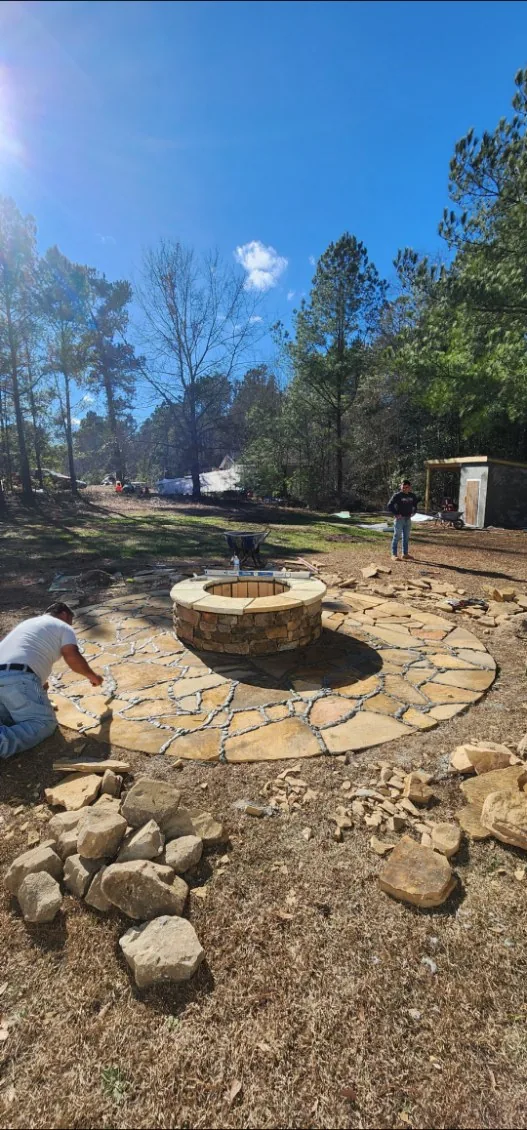 Flagstone fire-pit patio mid-build